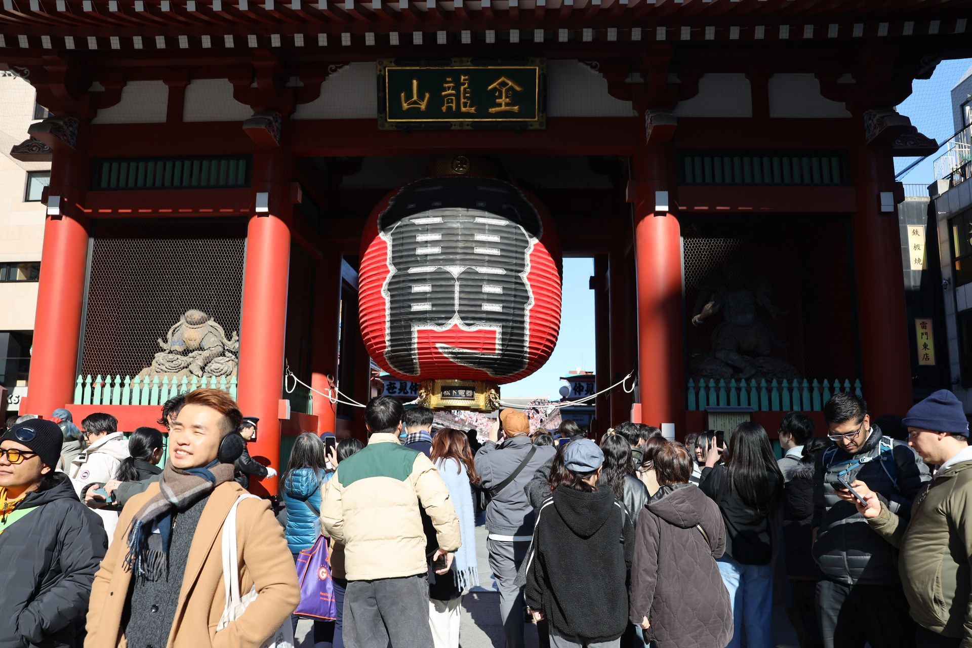 Senso-ji Temple in Asakusa Tokyo with traditional gate and visitors in historic district
