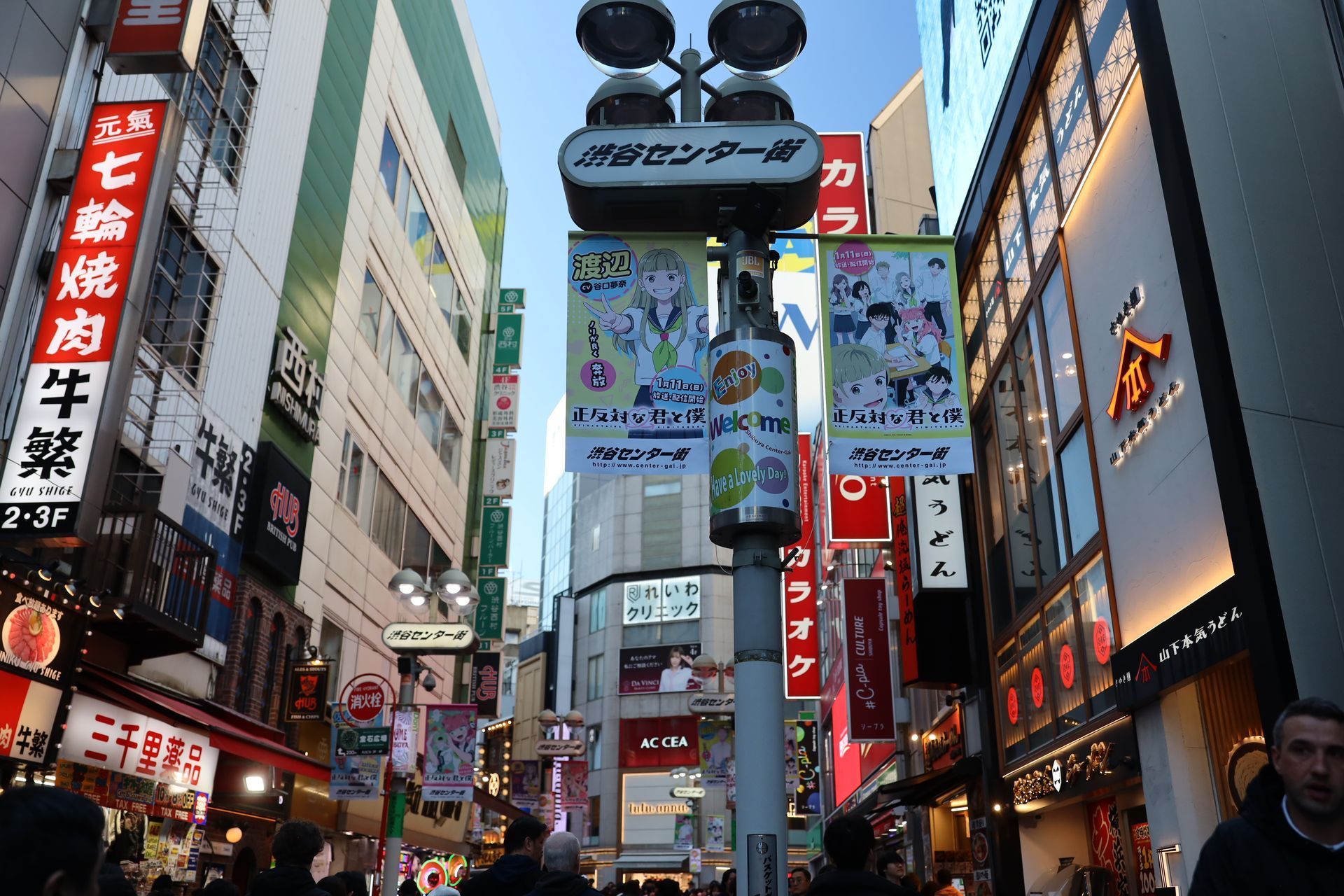 Shinjuku Tokyo city streets with neon signs, tall buildings, and busy nightlife district