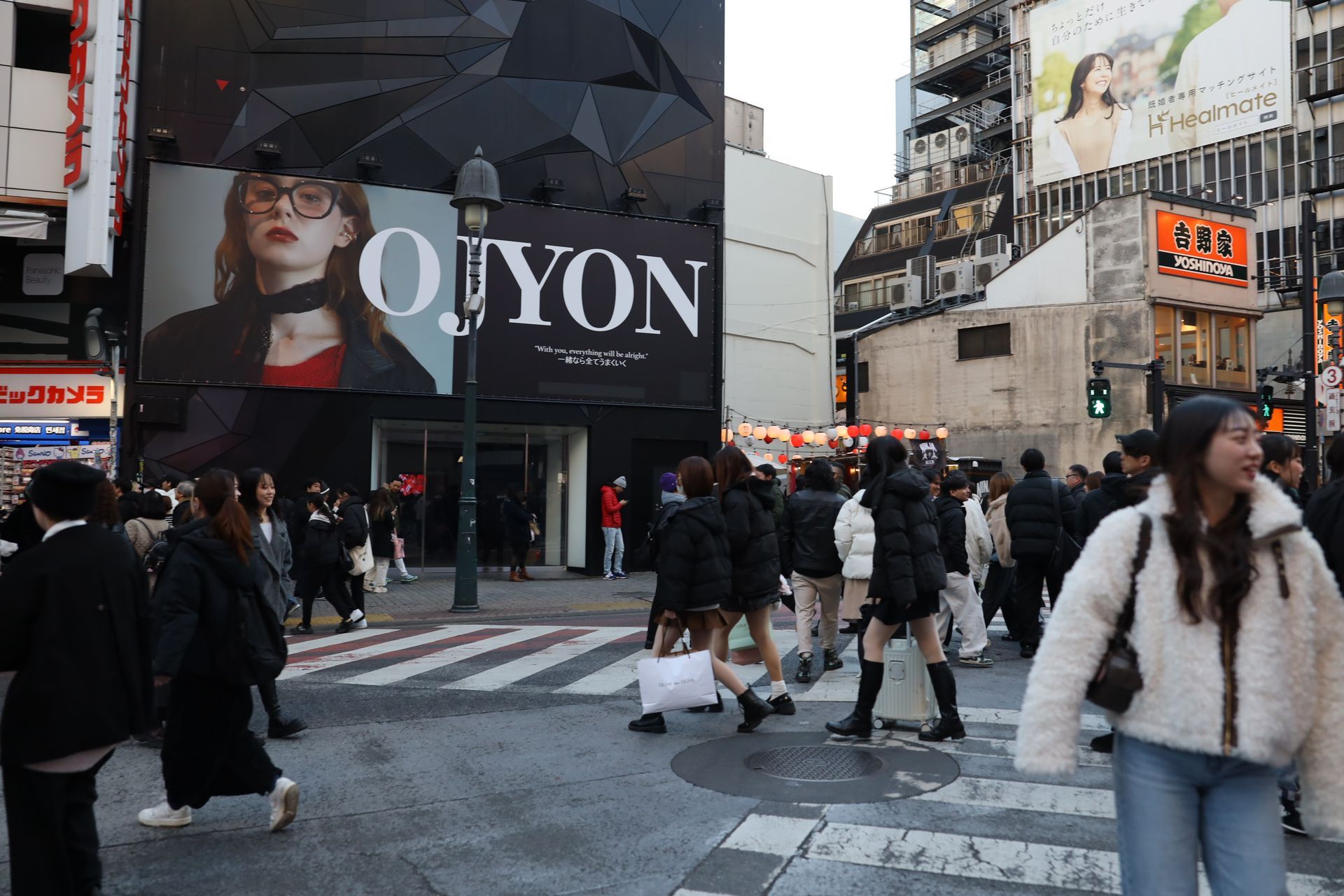 Shibuya Crossing in Tokyo with crowds crossing at one of the world’s busiest intersections