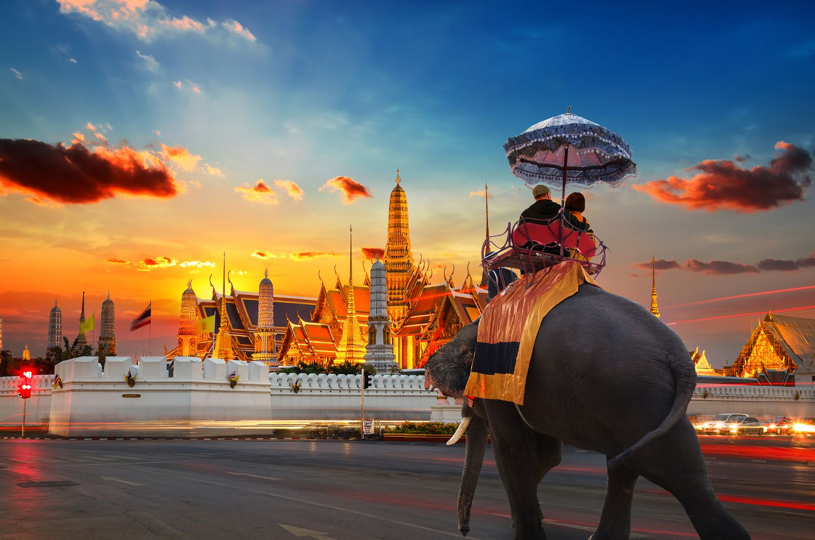 Spacious modern living room with dining area, beige and gray tones, large windows, and a colorful rug.