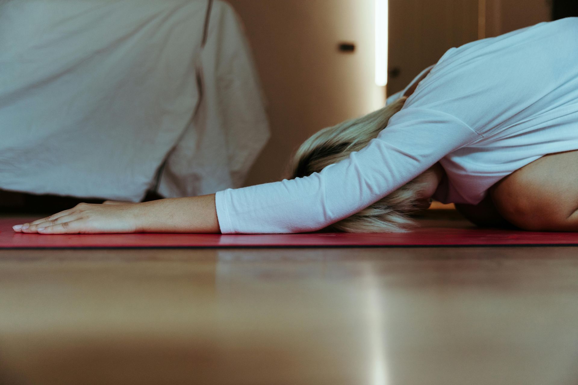 Curly hair woman practice child's pose yoga for divorce