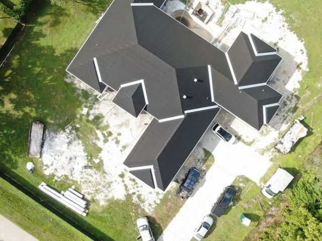 Aerial View of House with Black Roof | Bonita Springs, FL | Rams Roofing LLC