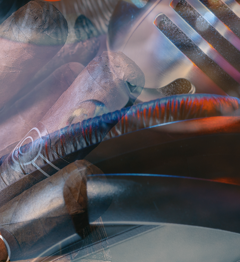 Basketball player in a blue and gold jersey dribbles the ball, eyes focused, during a game. Audience visible in the background.