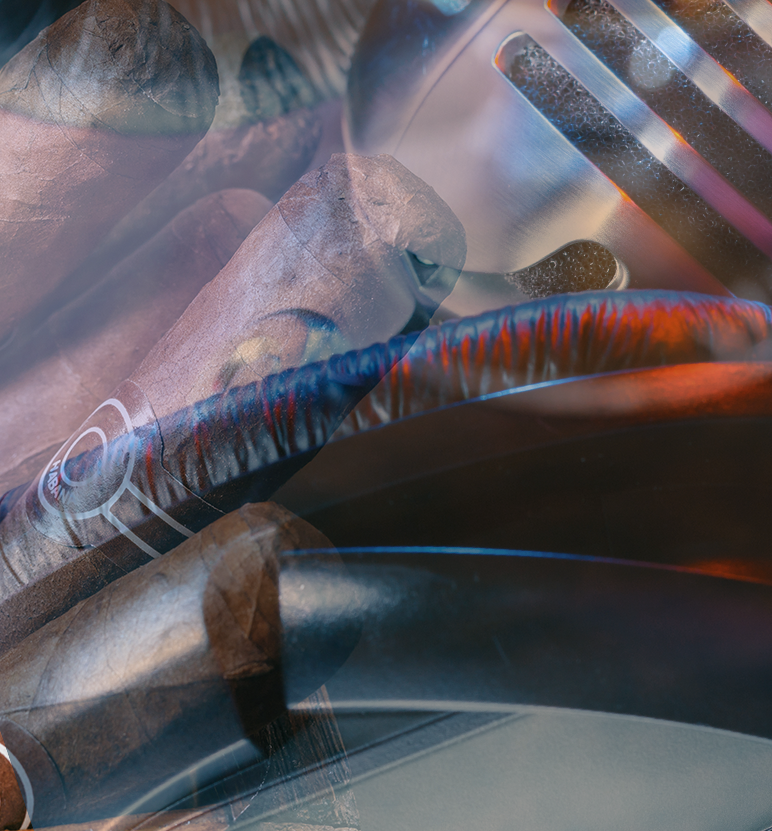 Basketball player in a blue and gold jersey dribbles the ball, eyes focused, during a game. Audience visible in the background.