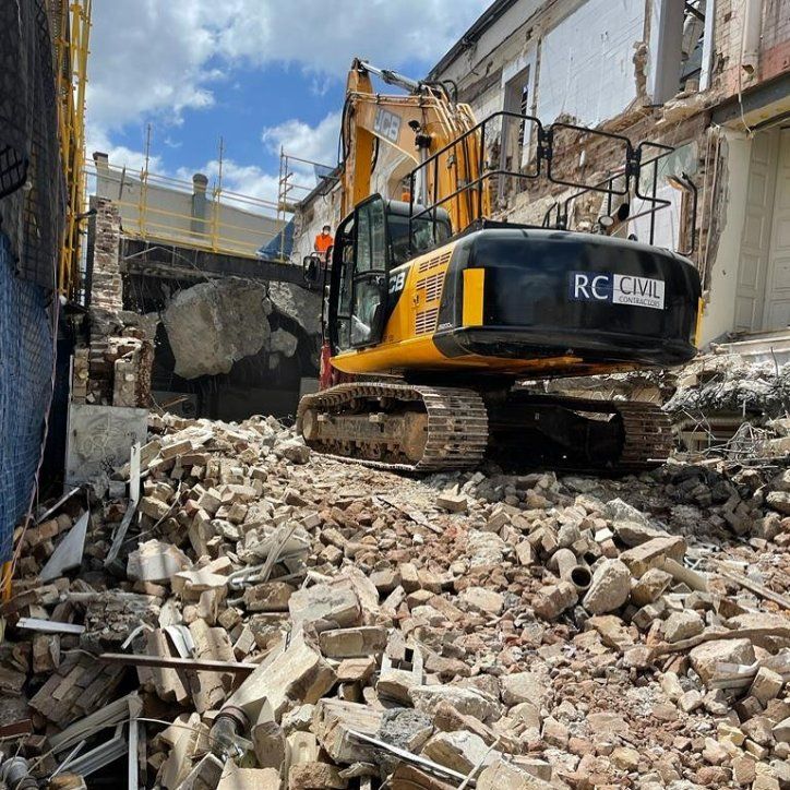A Yellow Excavator with A Logo that Says RC Civil — RC Civil in Armidale, NSW