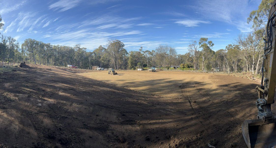 A Large Empty Field with Trees and A Blue Sky in The Background — RC Civil in Armidale, NSW