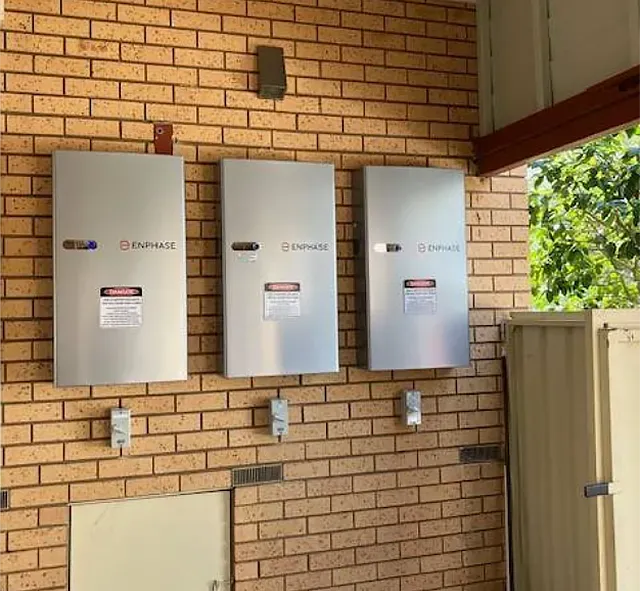 Solar Batteries on Brick Wall in a Garage — Todd Basham Electrical in Temora, NSW