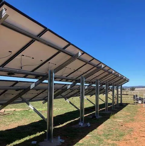 A Row of Solar Panels in a Paddock — Todd Basham Electrical in Temora, NSW