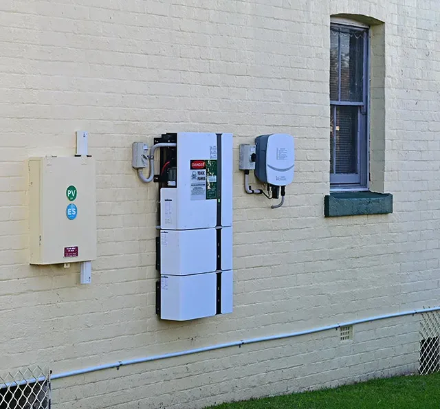 Row of Solar Battery on A Brick Wall — Todd Basham Electrical in Harden, NSW