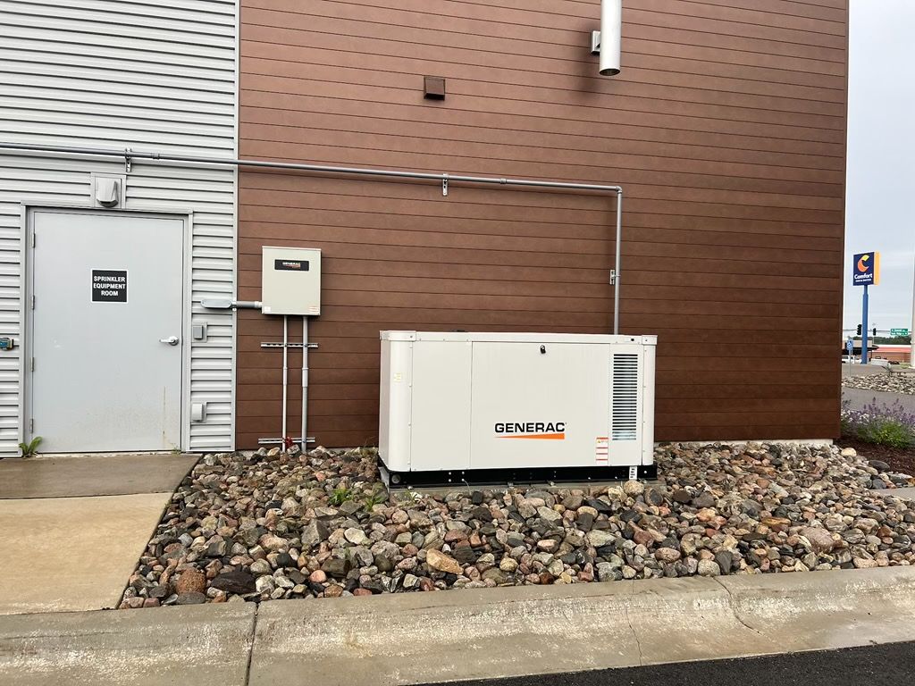 A generator is sitting on the side of a building