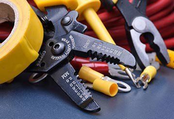 Tools for electrician and cables on metal surface - Electrical Repairs in Cook, MN
