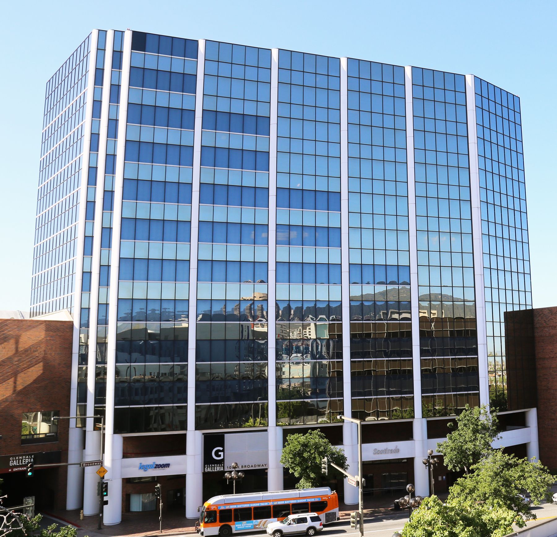 Unified School District and the Ernie B. Sotomayor Education Center, with greenery and a blue sky.