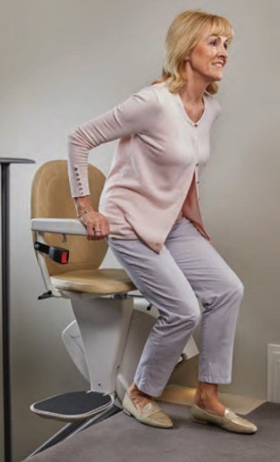 Woman Standing From Her Stair Lift Chair