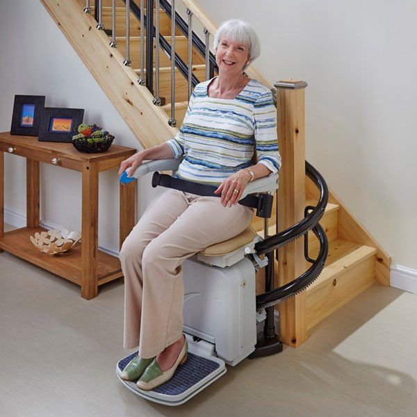 Happy Old Woman With Her New Stair Lift