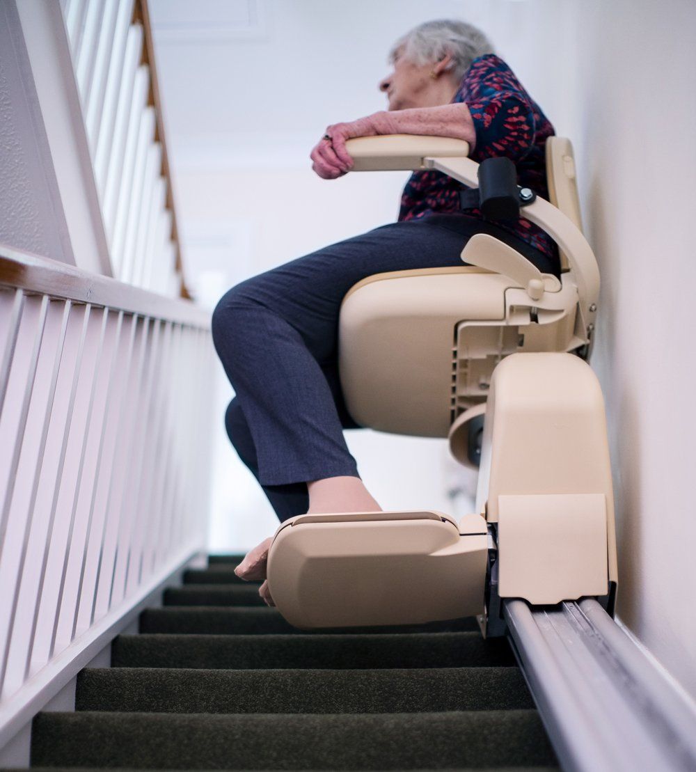 An Old Woman Riding Her Stair Lift