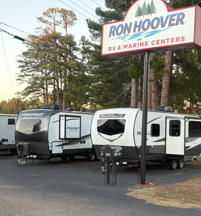 Ron Hoover RV & Marine Centers sign with several RVs parked in front.