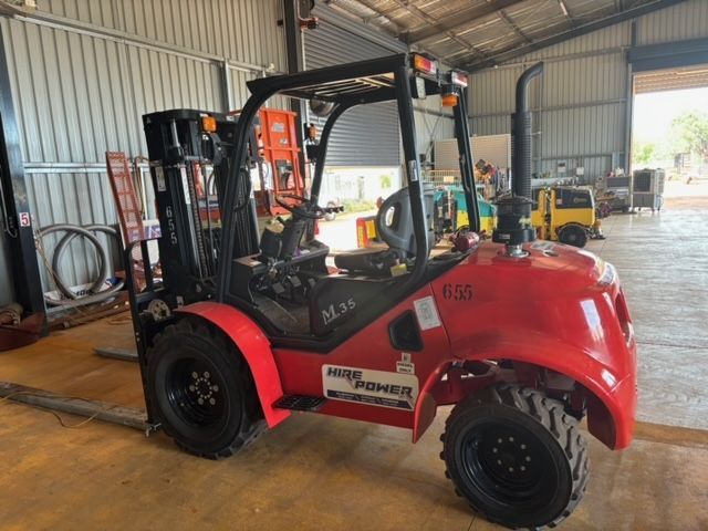 Earthmoving Machinery Parked Outside The Office — About Us in Palmerston, NT