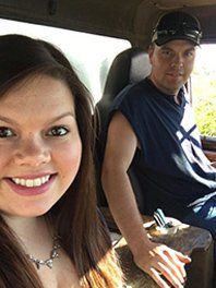 Young man and a woman on a passenger seat — Septic tank service in Abingdon, VA