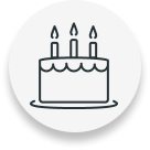 Birthday cake with three lit candles.