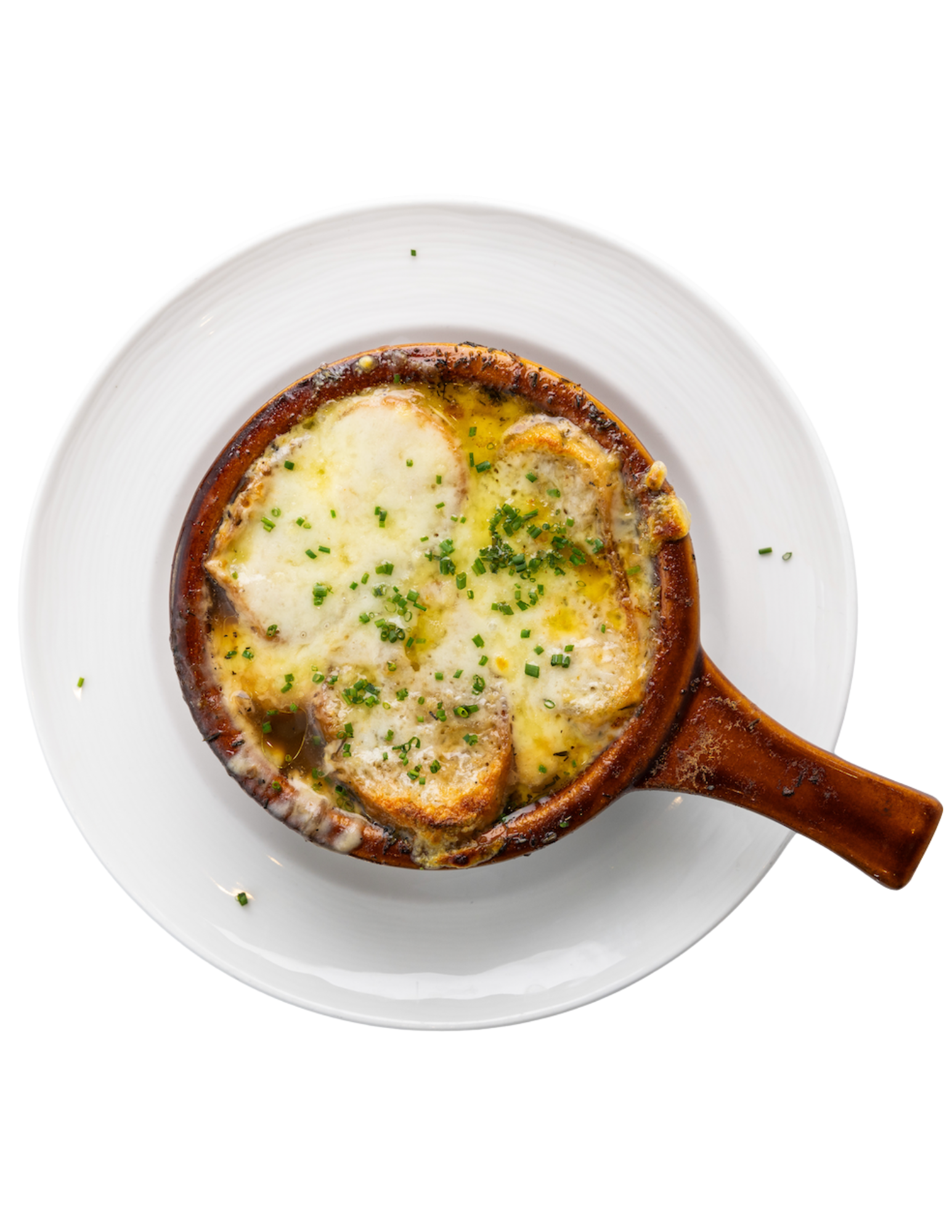 A bowl of french onion soup on a white plate