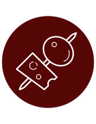 A cheese and olive skewer on a dark red background.