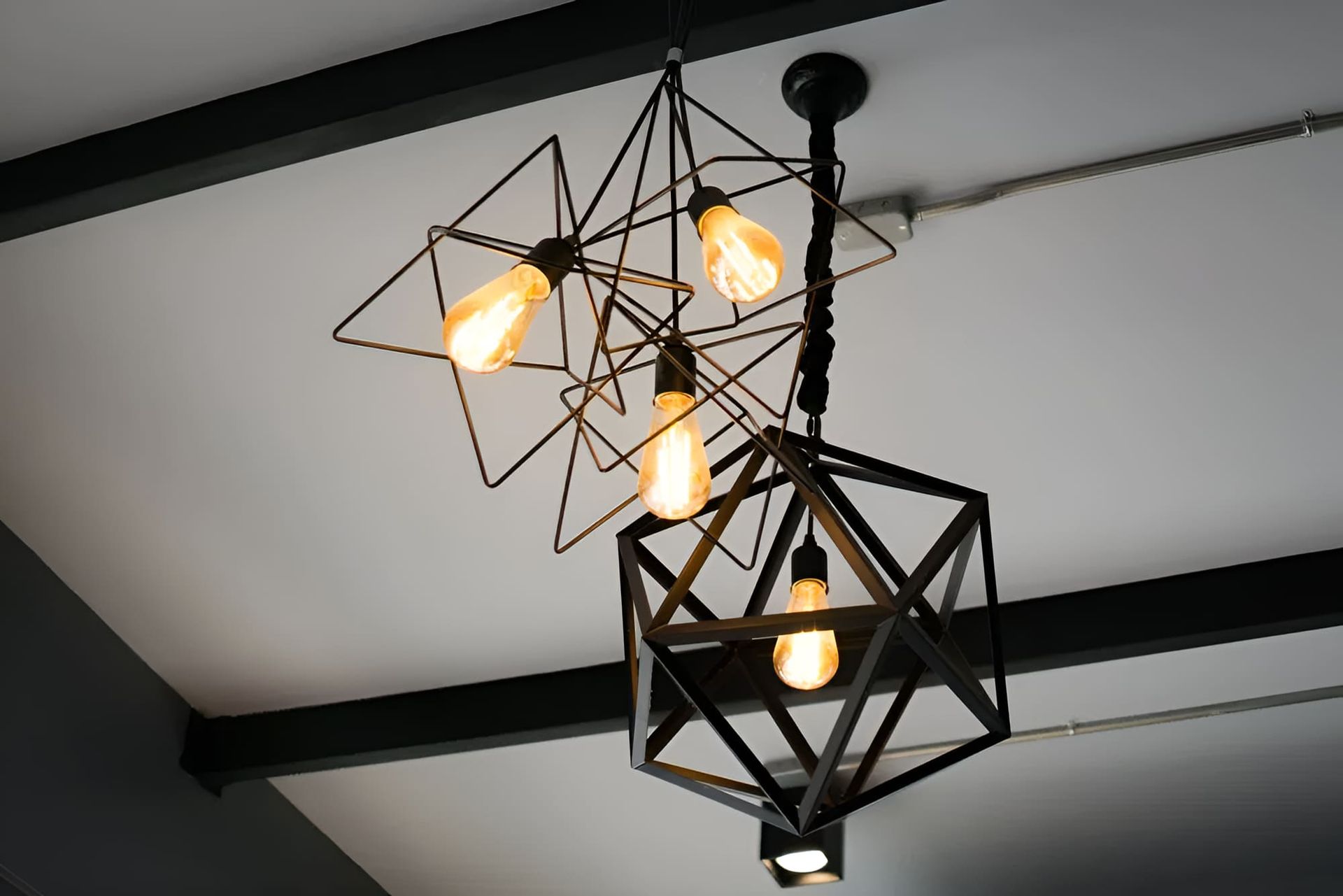 A close up of a light fixture hanging from the ceiling — Peter Jones Electrical In Bonny Hills, NSW