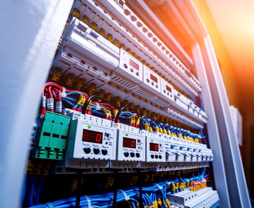 A Large Electrical Cabinet Filled With Lots Of Wires And Electronics — Peter Jones Electrical In Bonny Hills, NSW