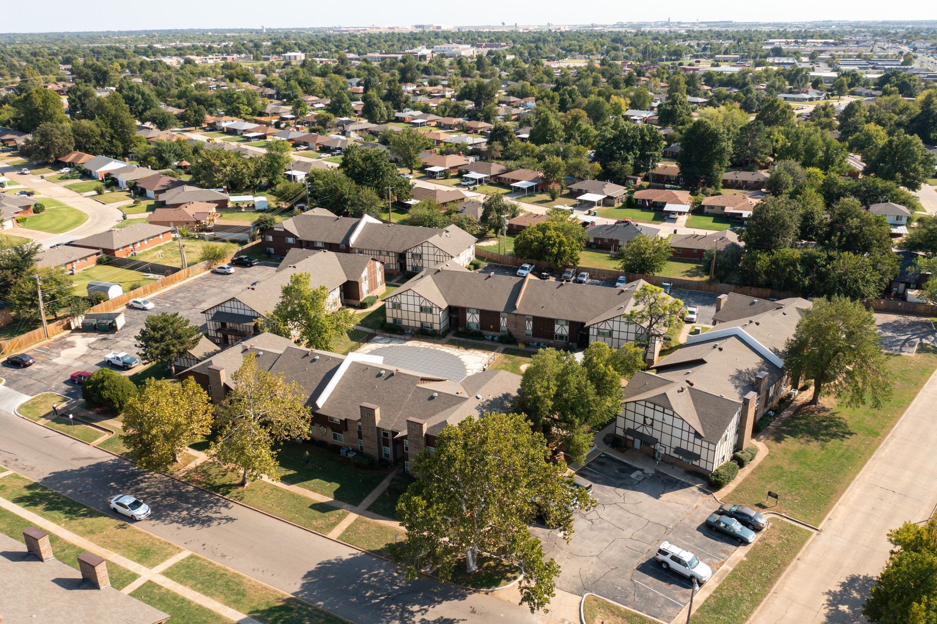 An aerial view of a residential area with lots of houses and trees.