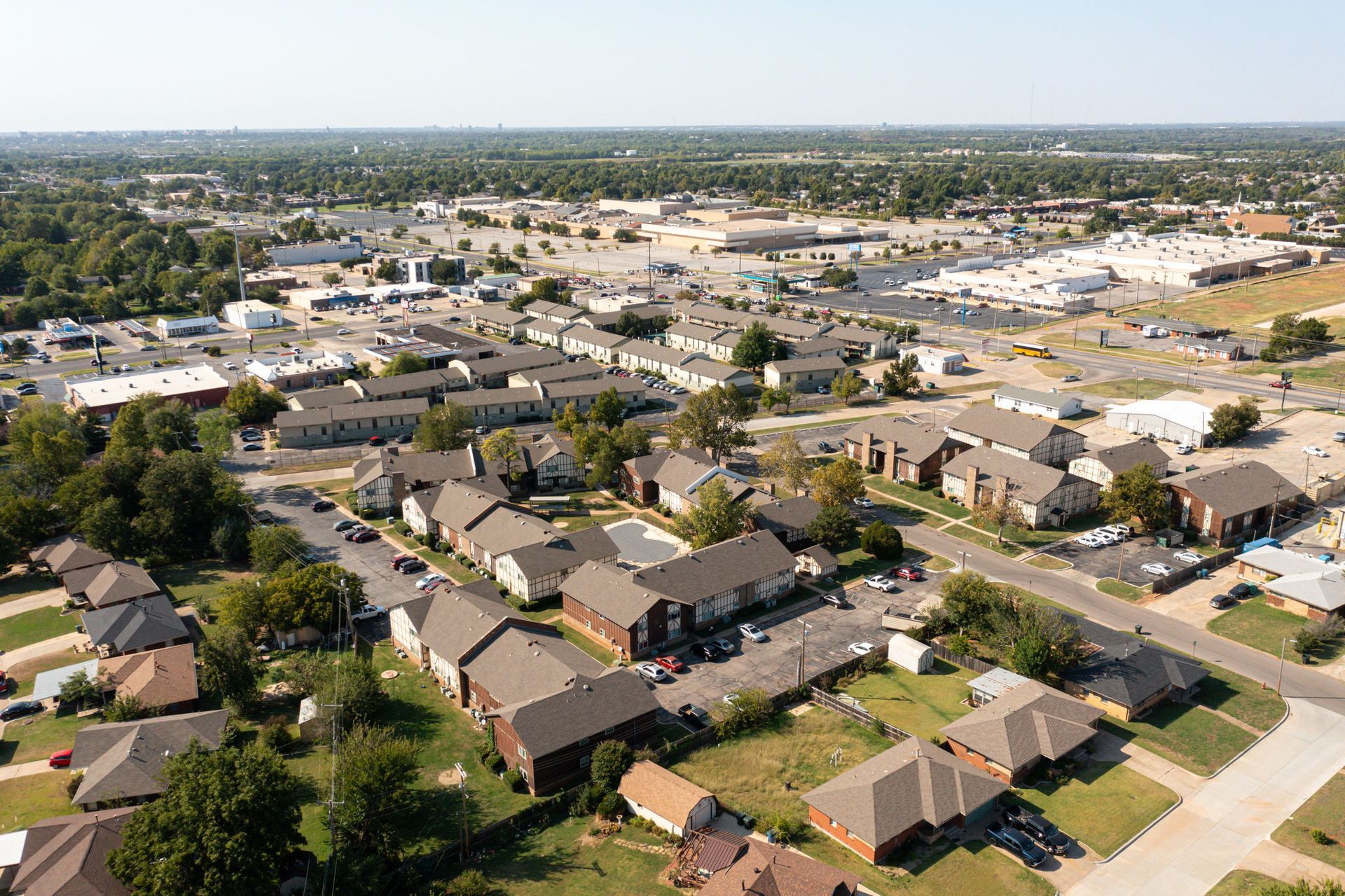 An aerial view of a residential area with lots of houses and trees.
