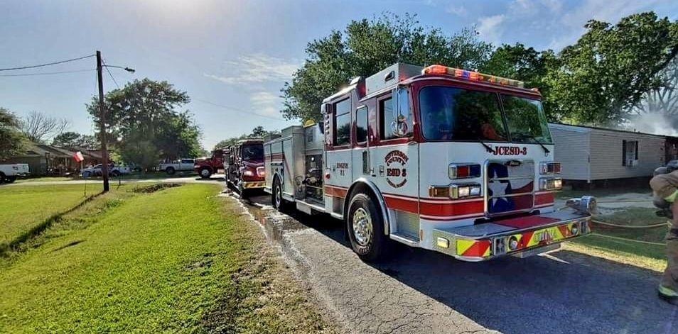 A fire truck is parked on the side of the road.