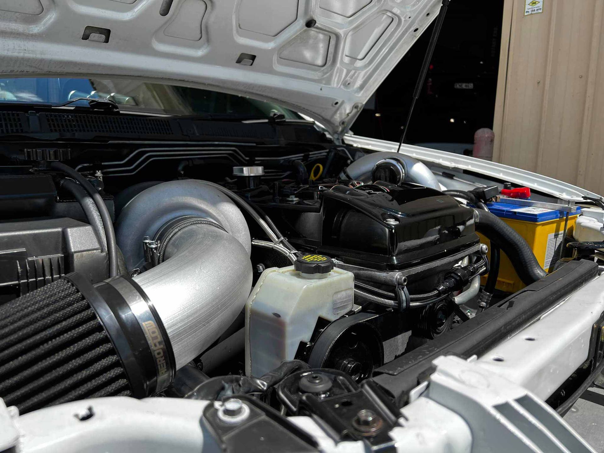 Car with Opened Bonnet Showing Engine  — Trusted Car Mechanic in Canberra