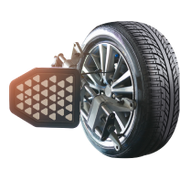 Tire with wheel alignment tool attached, showing the tire's tread and a silver rim on a white background.