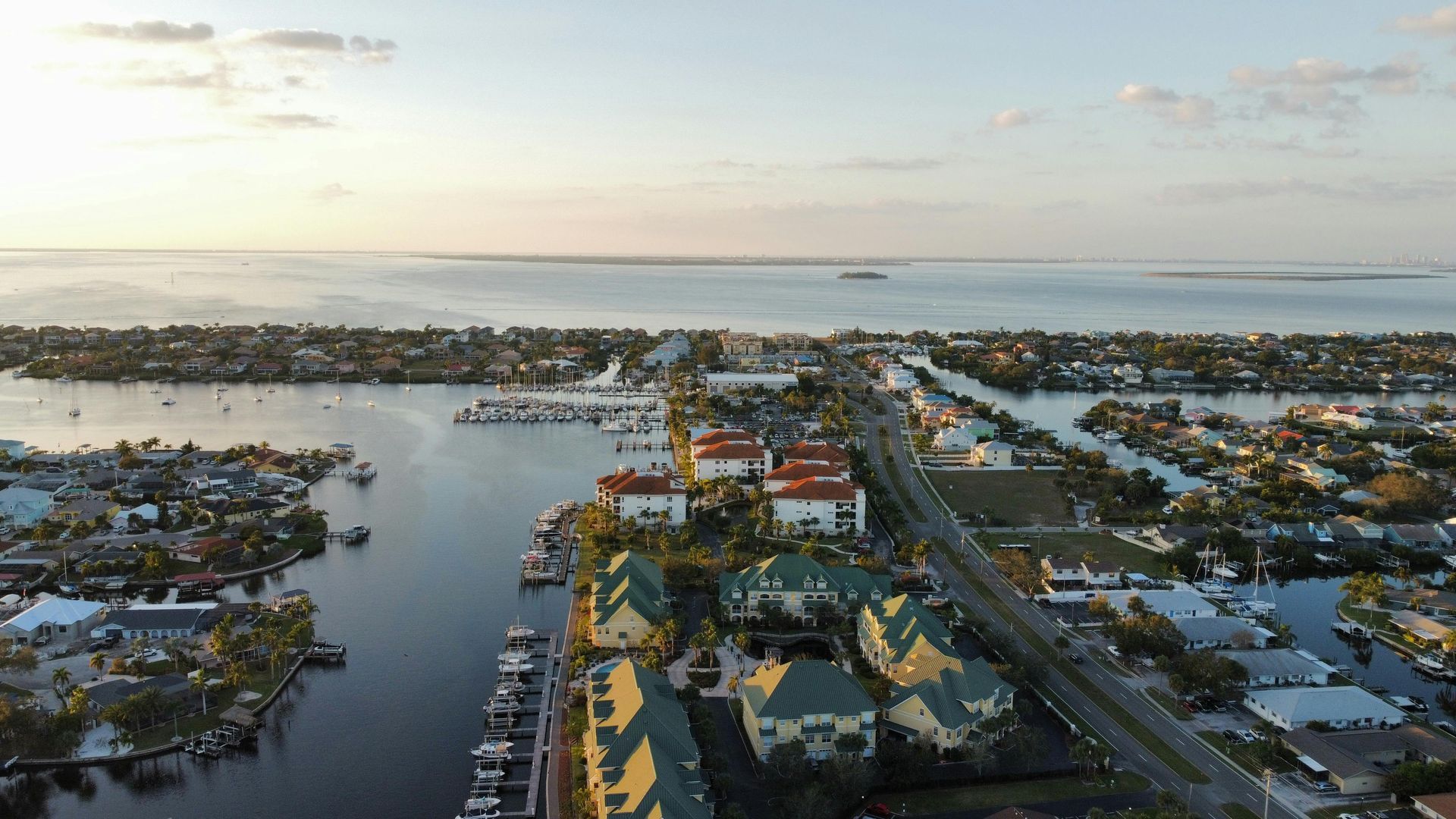 A man in a suit and tie is standing with his hands in his pockets.