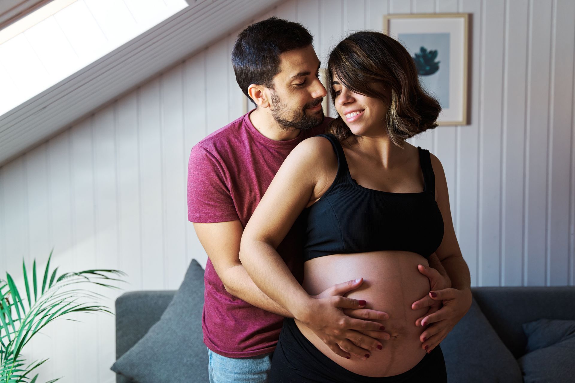 A Man With His Pregnant Wife In A Living Room — Nicholson, PA — Optimal Whole Health & Nutrition