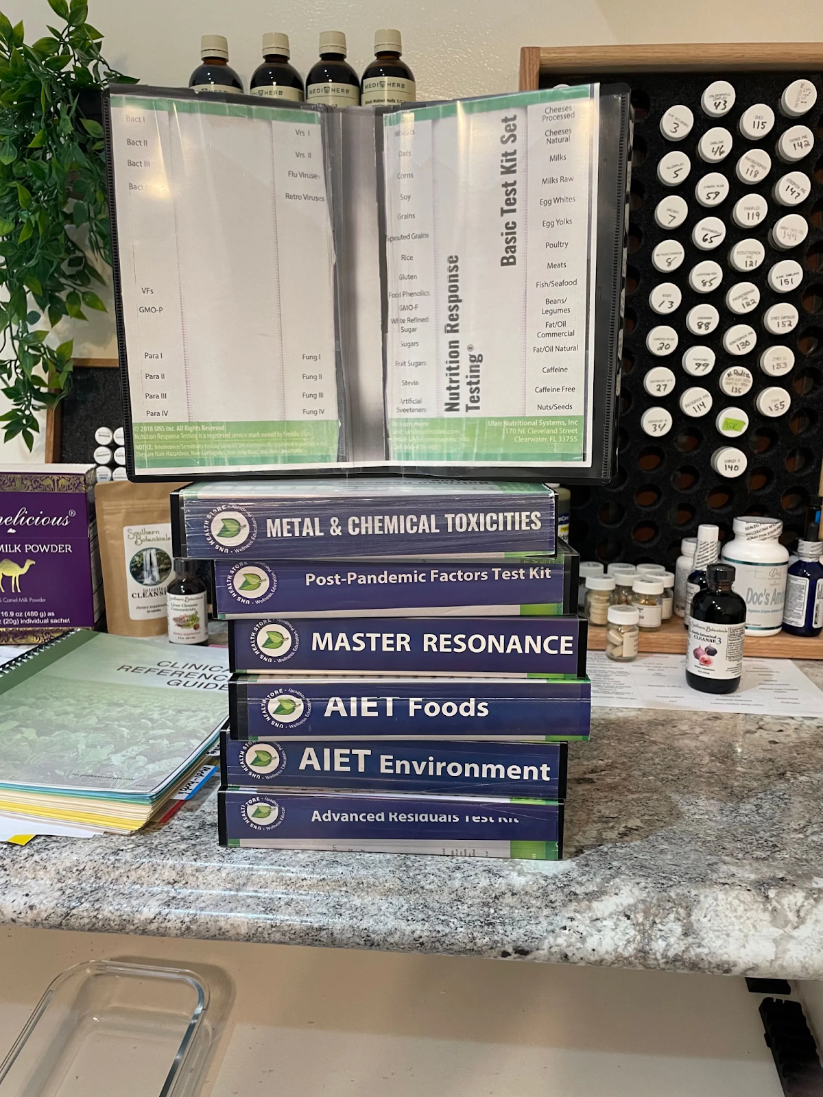 A stack of books sitting on top of a counter.