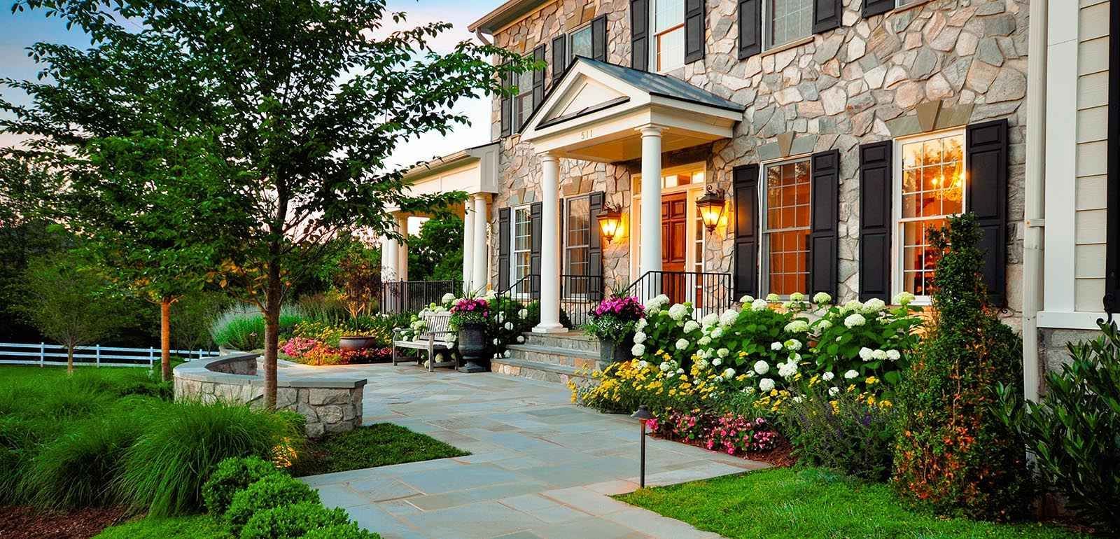 Beautiful front-yard garden with flowering shrubs and trees 