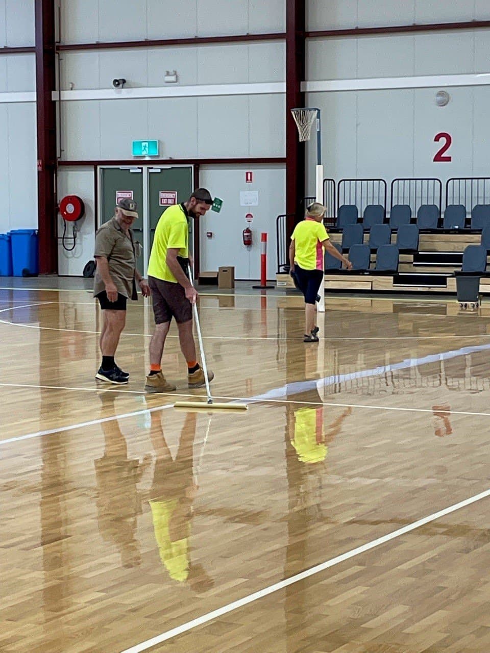 Men Polishing Stadium Floor - Flooring in Alice Springs, NT
