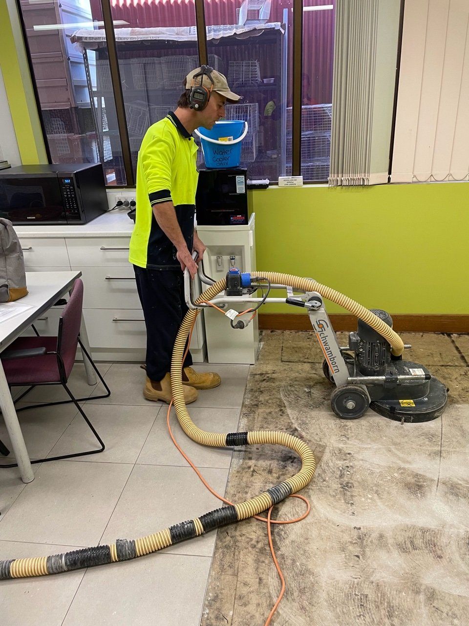 Worker preparing floor - Flooring in Alice Springs, NT