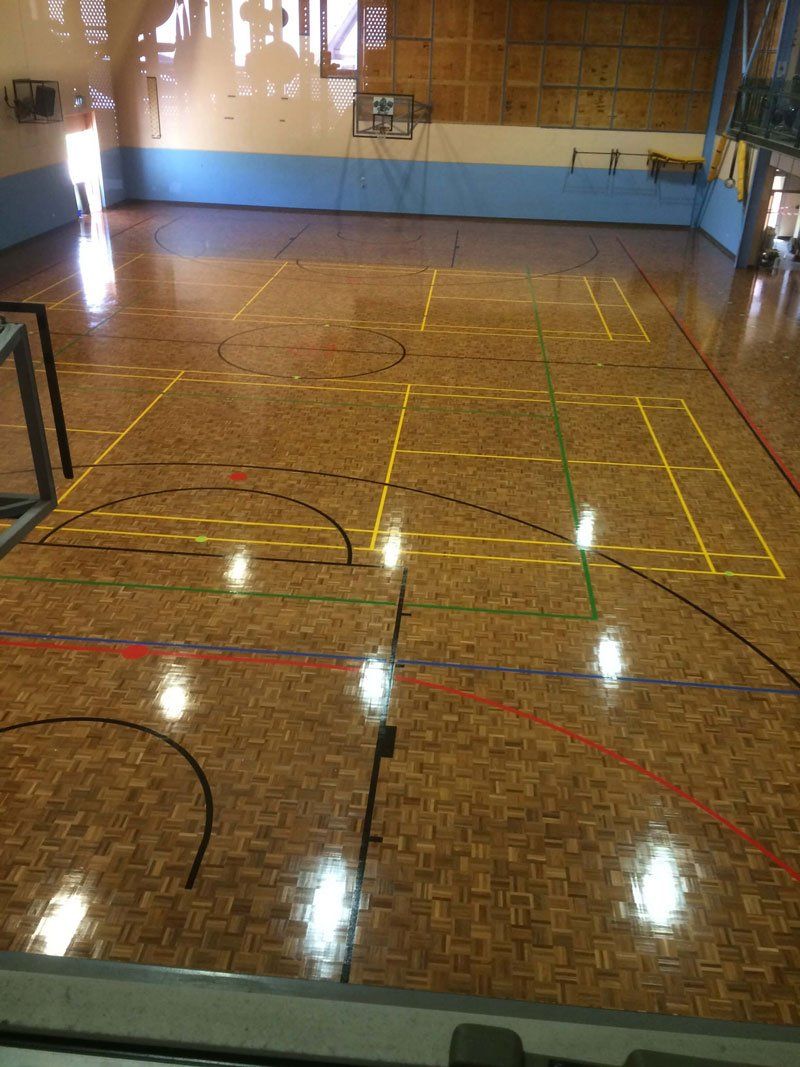 A Basketball Court With A Hardwood Flooring - Custom Design Flooring in Alice Springs, NT