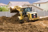 earth moving contractor excavating residential area