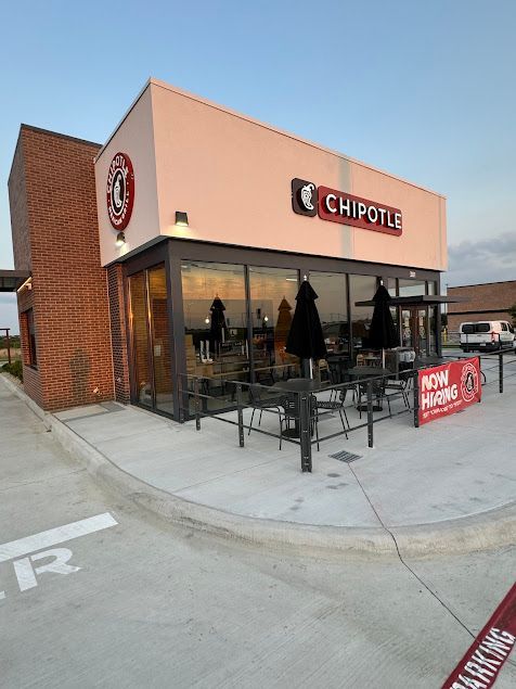 Mend Electric LLC - A chipotle restaurant with a sign that says now hiring