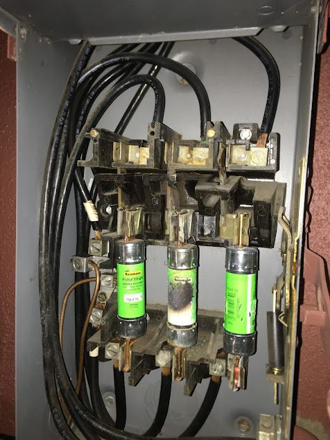 Mend Electric LLC - A box with a bunch of fuses and wires in it