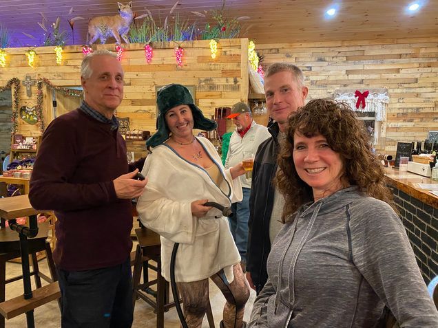 A group of people are posing for a picture in a restaurant.