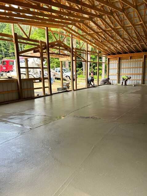 A large concrete floor in a building under construction.