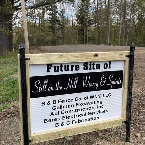 A sign for the future site of still on the hill winery and spirits
