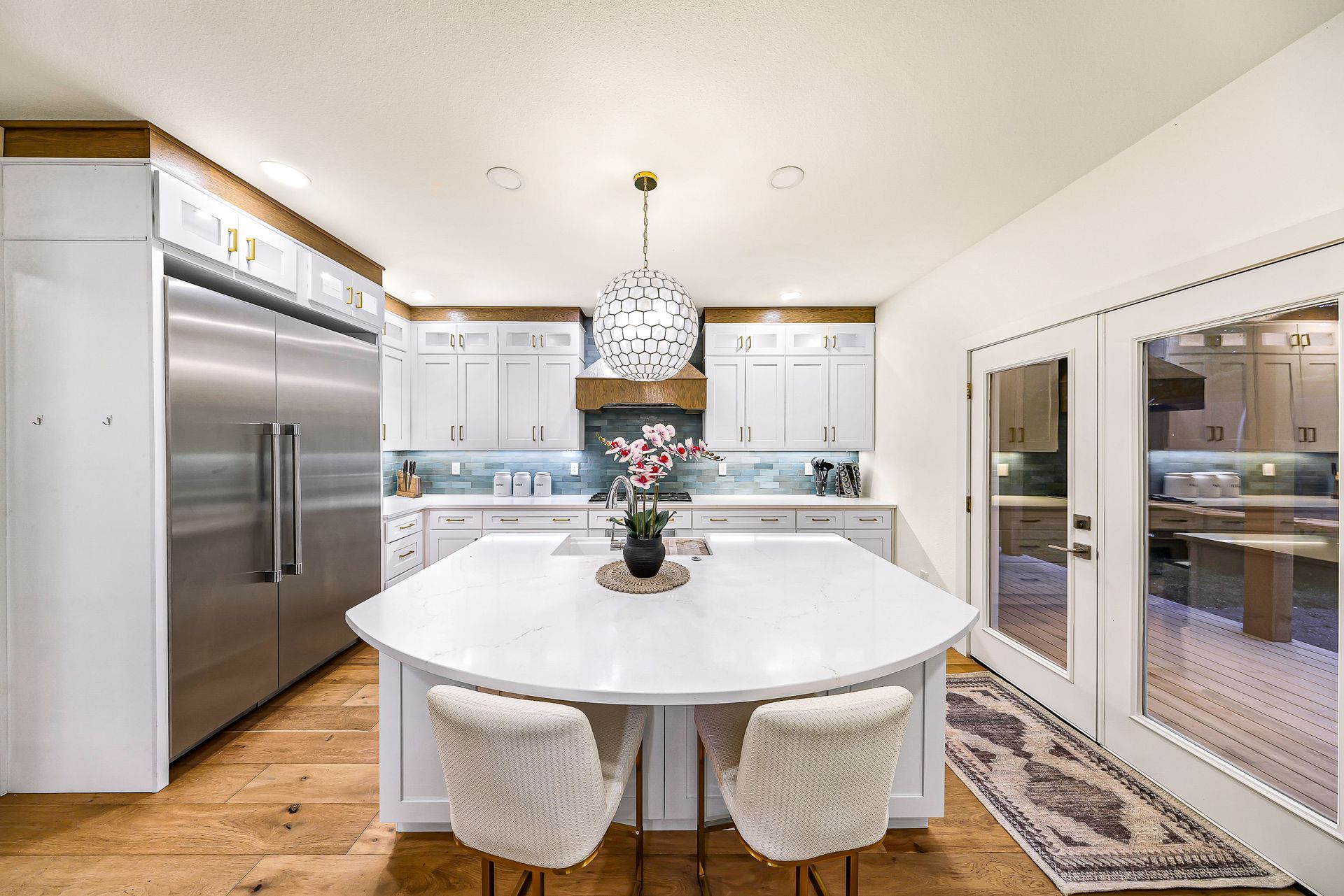 Exterior of 2155 Postal Avenue with blue siding, metal roof, and balcony.