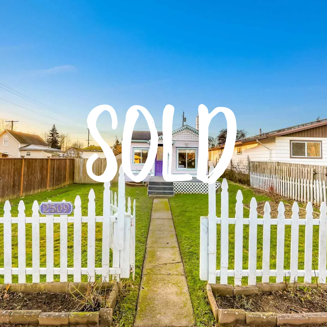 2509 Toledo ST behind a gate with a walking path.