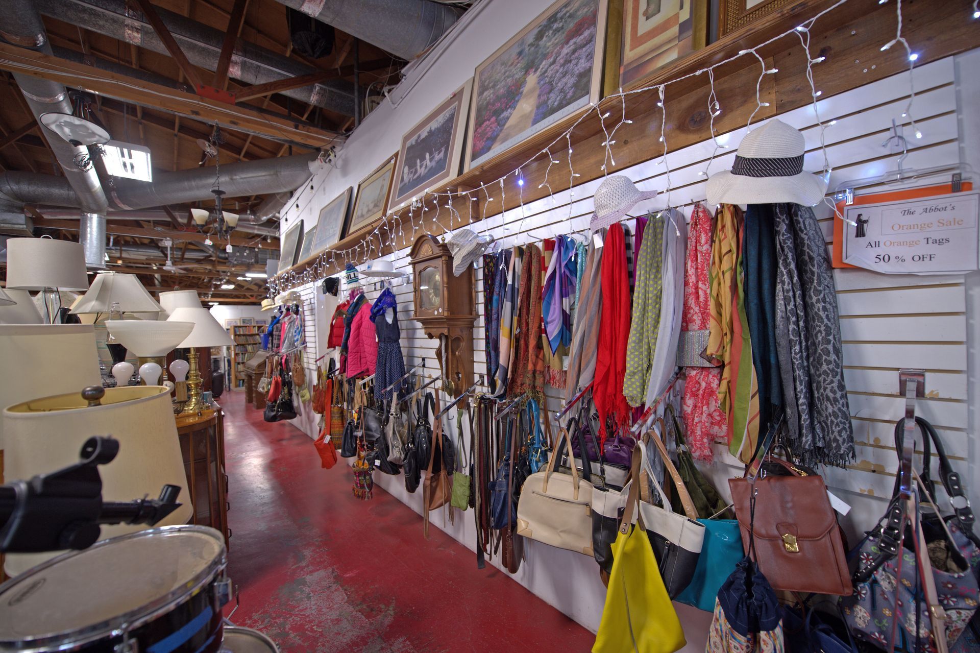 A store filled with lots of clothes and handbags.