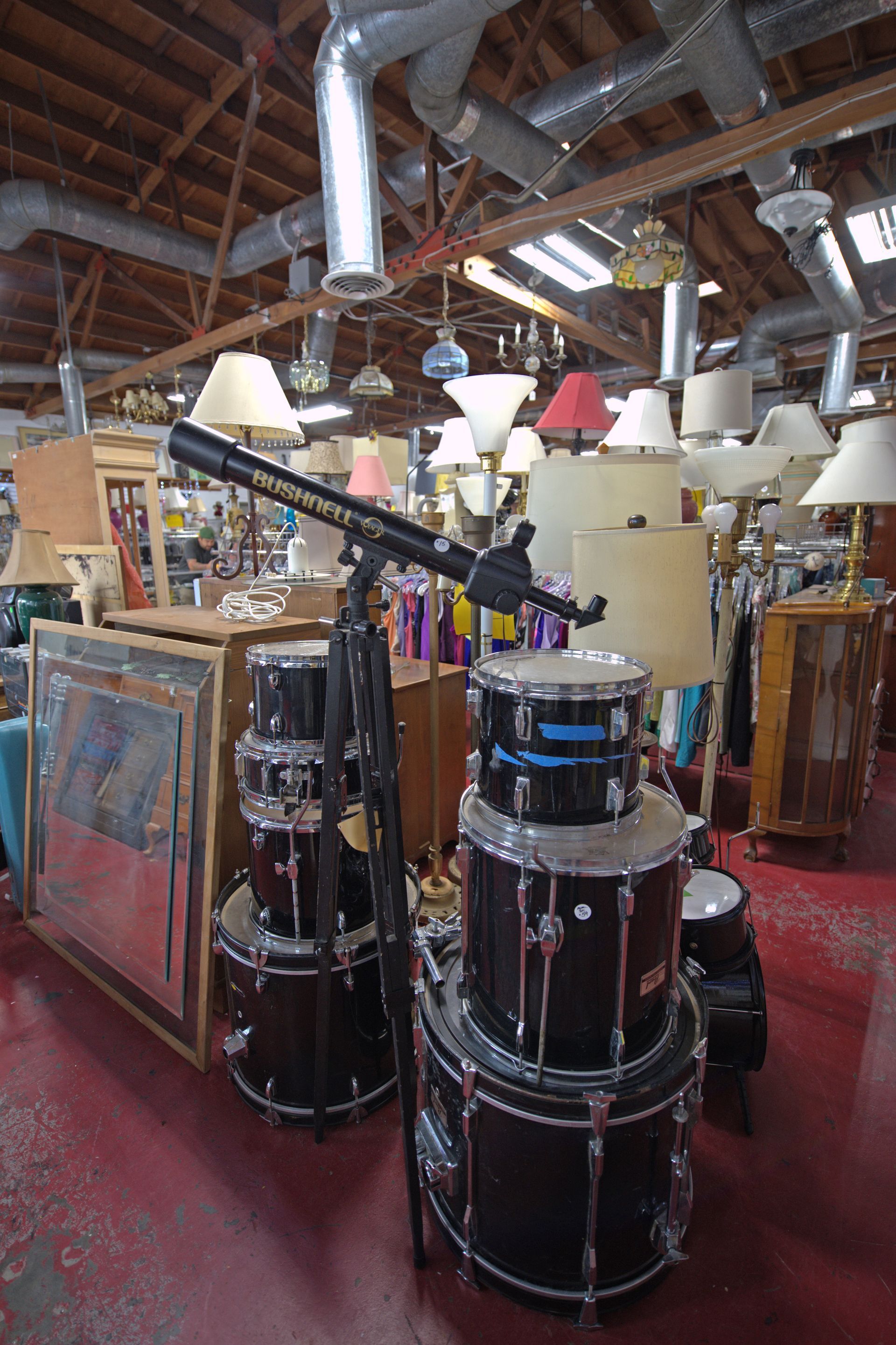 A drum set is stacked on top of each other in a store.