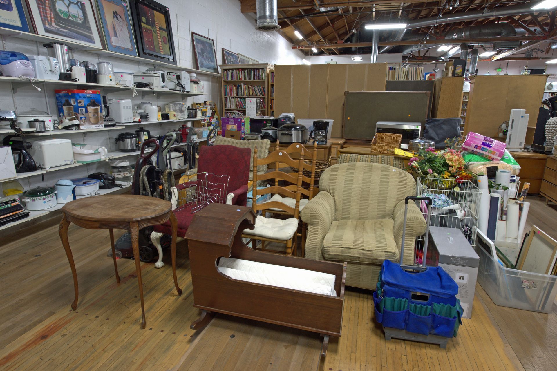 A room filled with lots of furniture including a chair and a table
